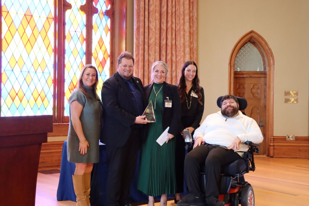 Photo of Jana Broussard holding her award, while standing next to Ashley Allen, the Governor’s Advisory Council on Disability Affairs Vice chairperson; Jay Isch, the Louisiana Association of the Deaf Executive Director; Julia Tanner, the Governor’s Advisory Council on Disability Affairs- Chairperson; and Liam Doyle, the Governor’s Office of Disability Affairs' Interim Executive Director.